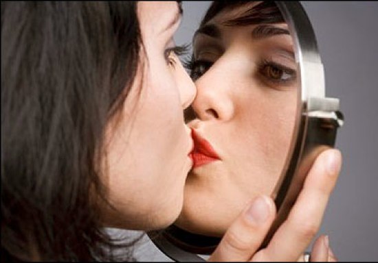 woman kissing the mirror